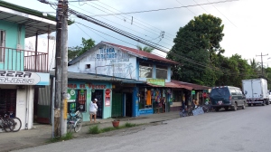 Street in Puerto Jimenez, shops selling gifts and soyuvenirs and a dvd rental place