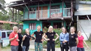 Girls standing in front of accommodation in Puerto Jimenez 